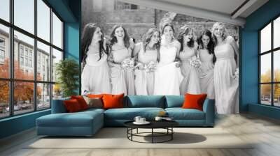 Beautiful bride with her pretty bridesmaids Wall mural