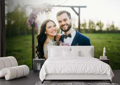 Happy bride and groom after wedding ceremony Wall mural