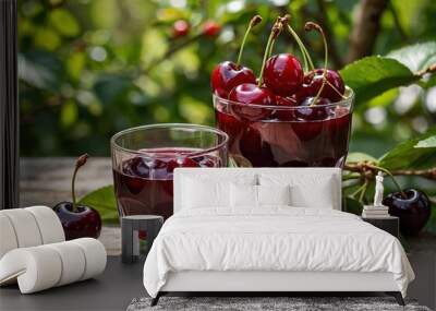 Fresh cherry juice, bunches of ripe berries in the garden Wall mural