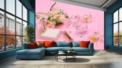 Cosmetics for makeup on pink background Wall mural