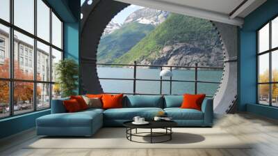 Mountains and Fjord through Old Pipe in Norway Wall mural