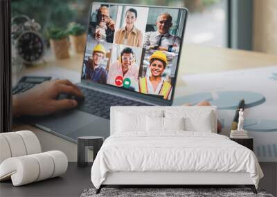 Group of creative construction engineer using laptop for video conference meeting and discussion about new project. Work from home, Working remotely during corona virus crisis. Wall mural