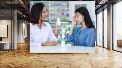 female patient and doctor in pharmacy Thailand Wall mural