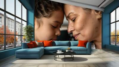 A heartwarming a mother and child in a gentle forehead-to-forehead bond. Their expressions convey warmth, love, and family intimacy in a cozy indoor setting. Wall mural