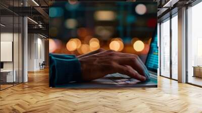 Close-up of a programmer's hands typing code on a laptop. Wall mural