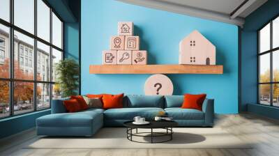 House buying factor with real estate home on weighting balance scale on blue background. Business mortgage loan investment and Property management team concept. Wall mural