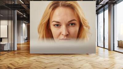 closeup of a woman who looks closely at her computer screen Wall mural