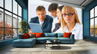 Young business woman with her team Wall mural