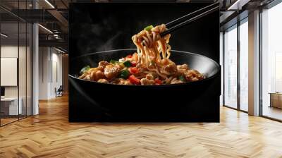 A bowl of chinese noodles with vegetables and chicken on a dark background, Chinese chopsticks picking up the food. Wall mural