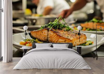 Perfectly grilled salmon with a vegetable sauce on a plate in a restaurant kitchen Wall mural