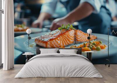 Perfectly grilled salmon with a vegetable sauce on a plate in a restaurant kitchen Wall mural