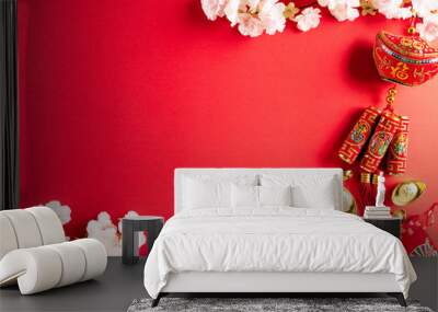 Chinese new year festival decorations pow or red packet, orange and gold ingots or golden lump on a red background. Chinese characters FU in the article refer to fortune good luck, wealth, money flow. Wall mural