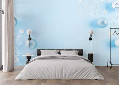 Christmas background concept. Top view of Christmas ball with snowflakes on light blue pastel background. Wall mural