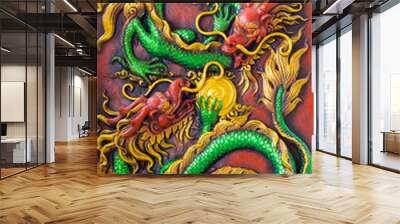 close up of the green dragon's fight on the red wall. Wall mural