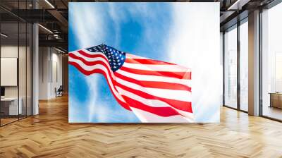 Close up United States of America flag on the blue sky background. USA Independence day, 4 July. Wall mural