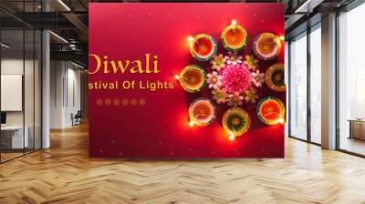 Happy Diwali - Clay Diya lamps lit during Diwali, Hindu festival of lights celebration. Colorful traditional oil lamp diya on red background Wall mural