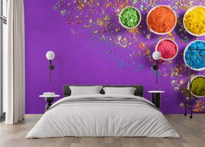 Happy holi festival decoration.Top view of colorful holi powder on purple  background with copy space for text. Wall mural