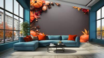 Thanksgiving and Autumn decoration concept made from autumn leaves and pumpkin on dark background. Flat lay, top view with copy space. Wall mural