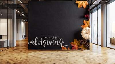 Thanksgiving background decoration from dry leaves,red berries and pumpkin on blackboard background. Flat lay, top view for Autumn, fall, Thanksgiving concept. Wall mural