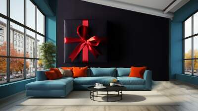 Top view of black christmas boxes with red ribbon on black background with copy space for text. black Friday composition. Wall mural