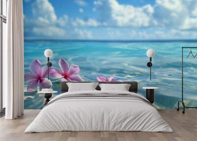 Brightly pink colored flowers on the surface of the ocean. Clear sea water and flowers on it Wall mural