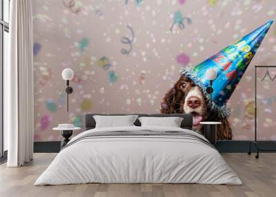 happy dog wearing a new year party hat with confetti falling Wall mural