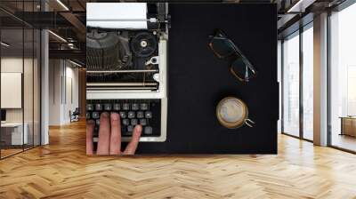 Vintage typewriter on  black background Wall mural