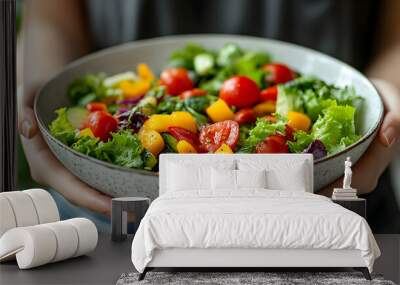 A fresh salad served in a bowl, highlighting vibrant vegetables. Wall mural