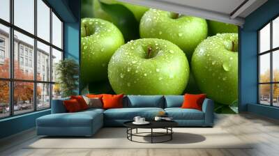 Fresh green apples with droplets on a surface, surrounded by leaves. Wall mural