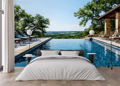 A serene infinity pool overlooking a scenic landscape with lounge chairs for relaxation. Wall mural