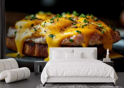 Close-up of eggs benedict with hollandaise sauce and chives on toasted bread. Wall mural