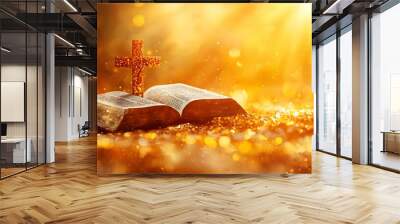 A Bible with a cross, illuminated by warm light, symbolizing faith and spirituality. Wall mural