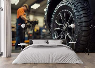 Black Truck Wheel with Shiny Rim and Deep Tread Tire Wall mural