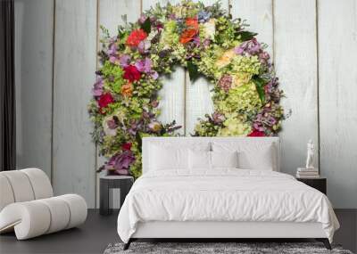 a beautiful flower wreath isolated on awooden background Wall mural