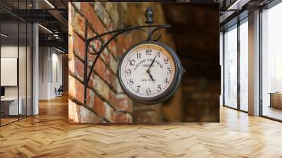 Old city street clock on a house wall Wall mural