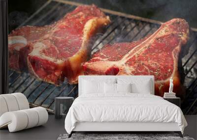 selection of meat and vegetables grilling on a portable summer barbecue outdoors with focus to a suc Wall mural