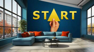 Businessman is holding arrows pointing up with start letters of growth and success or rising successful development and business development in the future. start concept Wall mural