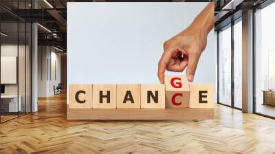 Hand flip wooden cube with the word CHANGE to CHANCE on white background. Concept of personal development Wall mural