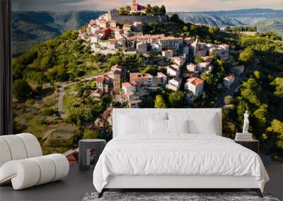 Aerial view of the ancient city of Motovun in summer, located on the top of the mountain. Istria, Croatia. Aerial drone footage. Wall mural