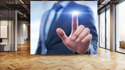 Businessman pressing button on virtual screen. Man pointing on futuristic interface. Innovation technology internet and business concept. Space for text and words. Abstract background. Wall mural