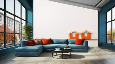 dual orange house icon on white space Wall mural