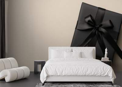 Elegant black gift box with ribbon, perfect for Christmas, birthdays, and special occasions, gift concept Wall mural