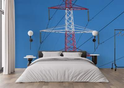 High voltage electricity pylon and power lines with clear blue sky Wall mural