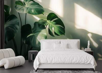 large green leaves in the foreground, with sunlight casting long shadows on white wallpaper, Generative AI Wall mural