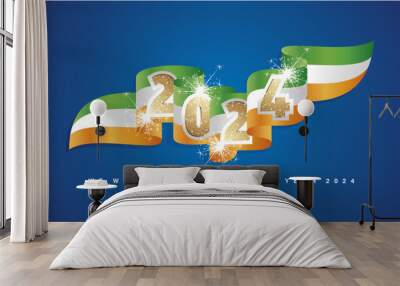 New Year 2024 concept design template with golden glitter 2024 front on Ireland wavy flag ribbon. Sparkle firework 2024 premium gold green white orange Ireland wavy flag ribbon vector on blue backgrou Wall mural