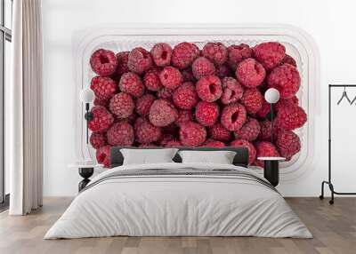 Box or punnet of fresh ripe organic raspberries isolated on white background Wall mural