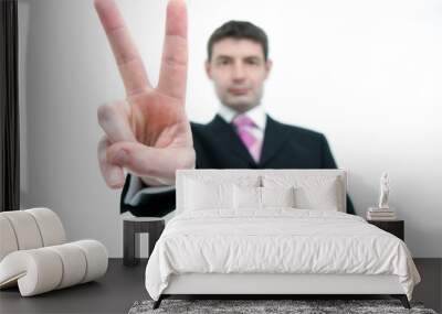 businessman holding up two fingers Wall mural