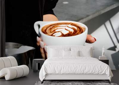 heart latte art, holding a mug of cocoa latte  Wall mural