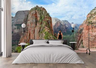 sportive woman at angels landing trail in zion national park Wall mural