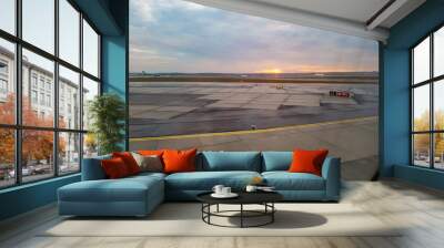 Sunrise over the apron before departure from the airport Wall mural